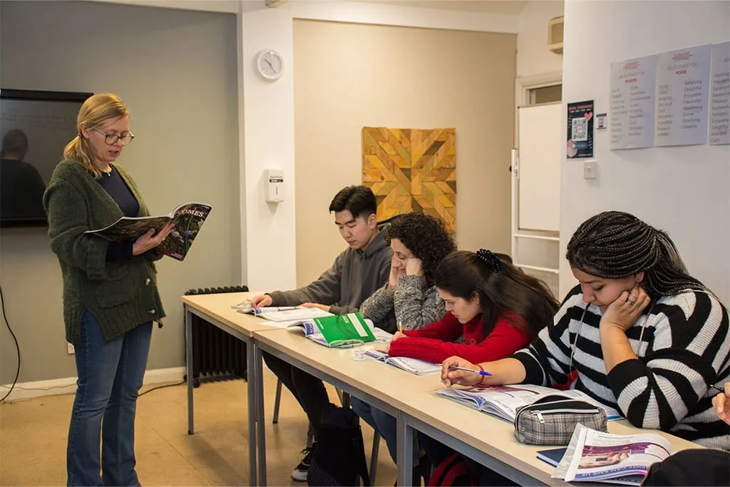 Teacher reading to students during an English class at ISI Dublin.