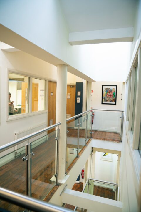 Upper-floor corridors and glass railings at ISI Dublin Meetinghouse Lane