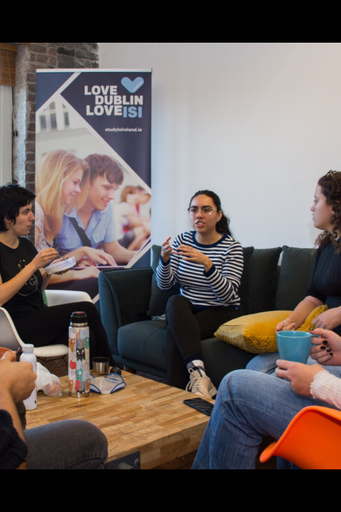 Students socialising in the school lounge at ISI Dublin Meetinghouse Lane