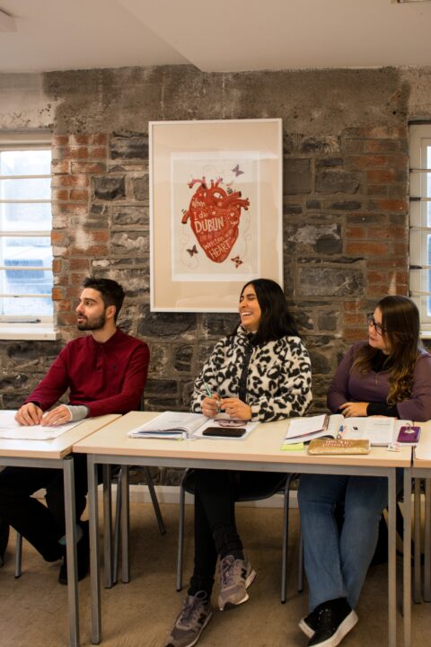 Classroom with stone walls and adult students at ISI Dublin Meetinghouse Lane